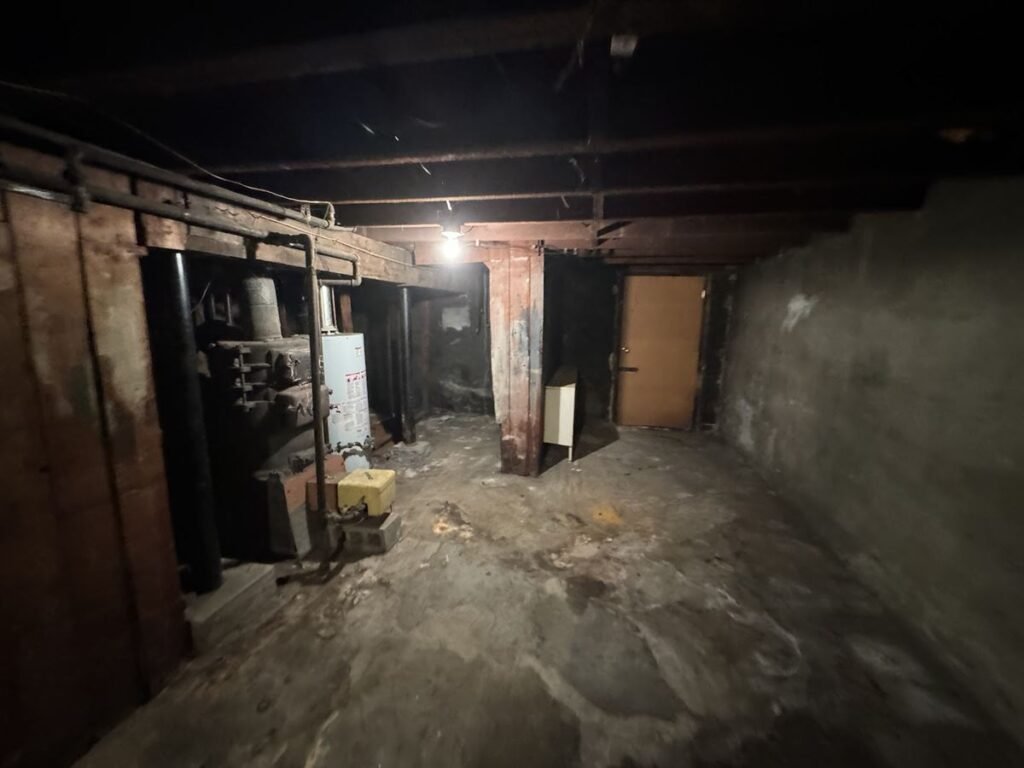 Empty basement floor after the junk was cleared out