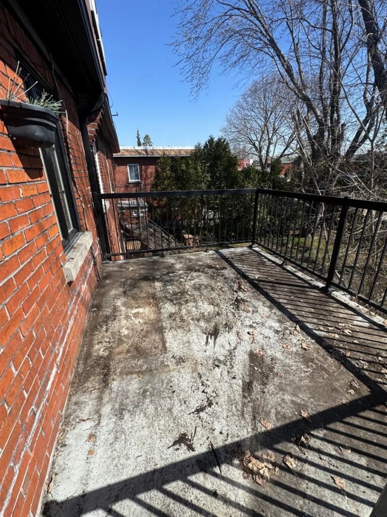 Bare balcony after old decking and junk were removed
