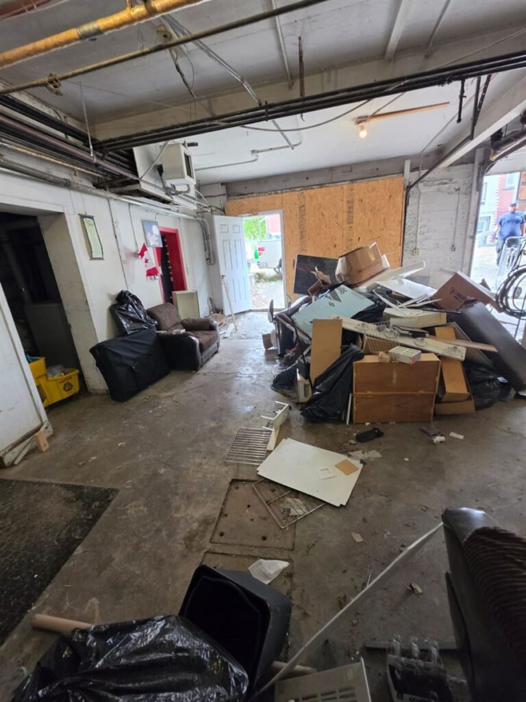 Junk piled inside a garage ready to be hauled away