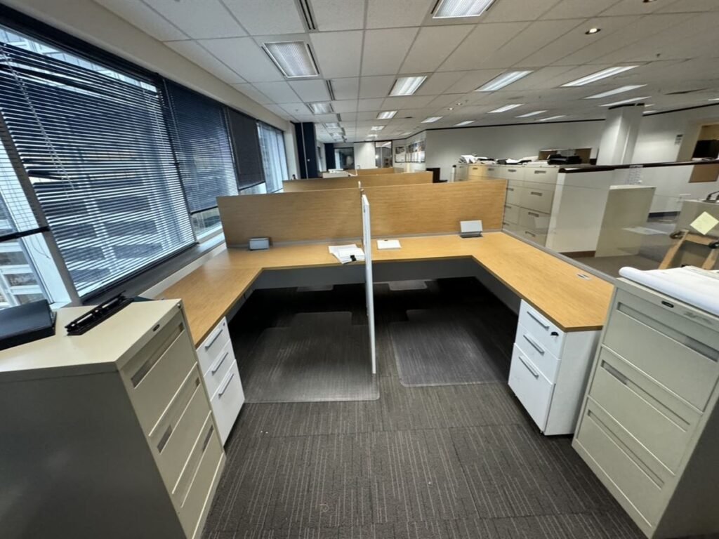 Office cubicle workstations and filing cabinets before removal