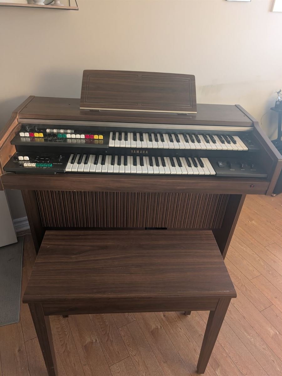 Home electric organ with bench ready for pickup
