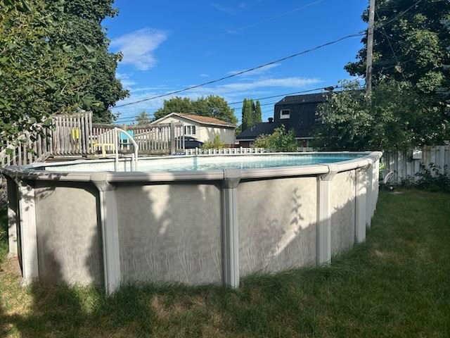 Round above-ground pool wall and frame ready to be taken down