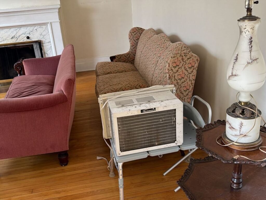 Living room furniture, a lamp and an air conditioner sorted for downsizing